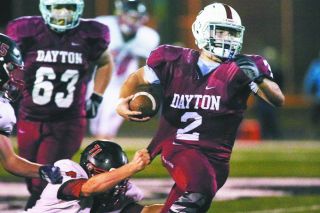 Rockne Roll/News-Register##
Dayton running back Zach Russell (2), breaks a tackle in the game against the Eagles Friday. Rockne Roll/News-Register##
Dayton running back Zach Russell (2), breaks a tackle in the game against the Eagles Friday.