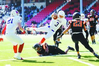 Rockne Roll/News-Register##
Linfield quarterback Aiden Wilder (3) dives into the end zone scoring the ‘Cats’ first touchdown in the Northwest Conference game against Lewis & Clark Saturday at Griswold Stadium in Portland. Rockne Roll/News-Register##
Linfield quarterback Aiden Wilder (3) dives into the end zone scoring the ‘Cats’ first touchdown in the Northwest Conference game against Lewis & Clark Saturday at Griswold Stadium in Portland.
