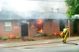 Paul Daquilante / News-Register##Firefighters attack the blaze at Second and Ford streets Tuesday morning. Paul Daquilante / News-Register##Firefighters attack the blaze at Second and Ford streets Tuesday morning.