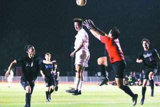 Rockne Roll/News-Register##
Nick Denley’s header against South Salem is caught by the Saxon goalie. The Grizzlies outshot their opponents, but wound up with a tie for the second consecutive league match. Rockne Roll/News-Register##
Nick Denley’s header against South Salem is caught by the Saxon goalie. The Grizzlies outshot their opponents, but wound up with a tie for the second consecutive league match.