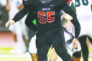Rockne Roll/News-Register##
McMinnville’s Stevie Ryan, called the heart of the Grizzly team by head coach Ryan McIrvin, looks for the ball carrier during his defensive stint against the Titans last Friday. Rockne Roll/News-Register##
McMinnville’s Stevie Ryan, called the heart of the Grizzly team by head coach Ryan McIrvin, looks for the ball carrier during his defensive stint against the Titans last Friday.
