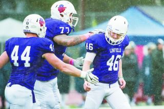 Marcus Larson/News-Register##
Linfield running back Blake Burnett goes airborne late in Linfield’s 12-6 win over George Fox. Marcus Larson/News-Register##
Linfield running back Blake Burnett goes airborne late in Linfield’s 12-6 win over George Fox.