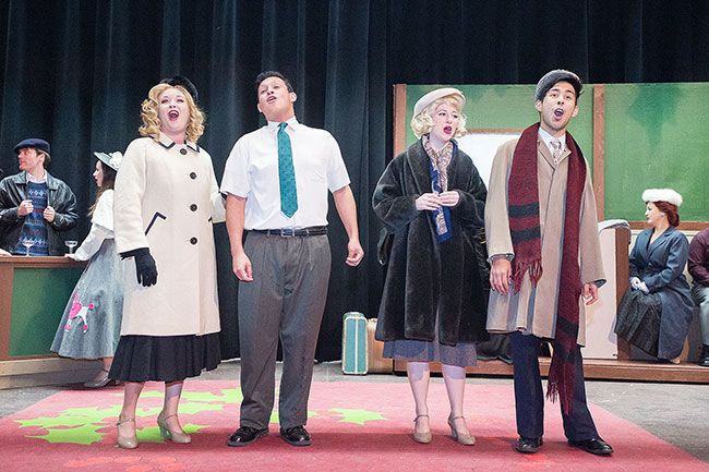 Marcus Larson/News-Register##Judy Haynes (Megan Read), Phil Davis (Luis Becerril), and two train passengers, (Heidi Tachan and Cesar Anguiano), perform a musical number in Gallery Theater’s “White Christmas.”