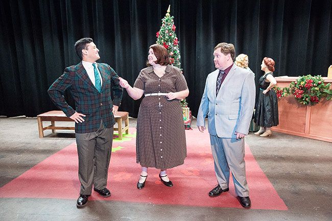 Marcus Larson/News-Register##Phil Davis (Luis Becerril), Martha Watson (Leslie Collins) and Bob Wallace (Seth Renne) discuss the show the two men have planned in Gallery Theater’s “White Christmas.” The show continues through Dec. 19.