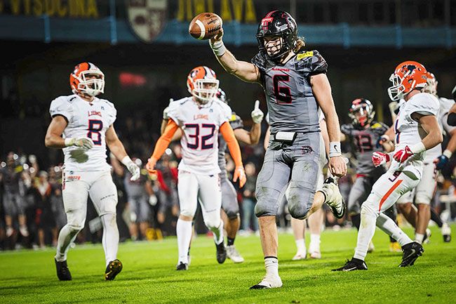 Petr Milfait/submitted photo##
Clark Hazlett races into the end zone during last month’s Czech Bowl in the Czech Republic. Hazlett, a former Linfield quarterback, accounted for three touchdowns in the 23-0 championship win over the Prague Lions.