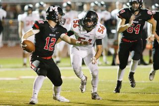 Rockne Roll/News-Register##
McMinnville quarterback Wyatt Smith (12) is chased down by Sprague s Spencer Nofzinger (56) in Friday s football matchup between the schools at Wortman Stadium. Rockne Roll/News-Register##
McMinnville quarterback Wyatt Smith (12) is chased down by Sprague s Spencer Nofzinger (56) in Friday s football matchup between the schools at Wortman Stadium.