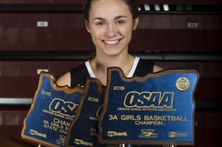 Rockne Roll/News-Register##
Shawnie Spink, the News-Register girls basketball Athlete of the Year, poses with her three state titles. Rockne Roll/News-Register##
Shawnie Spink, the News-Register girls basketball Athlete of the Year, poses with her three state titles.