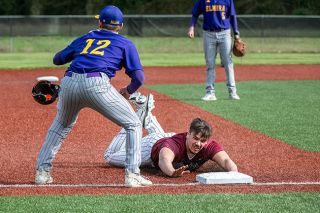 Rusty Rae/News-Register##Dayton catcher Zach Smith slides into third after cracking a triple into centerfield.