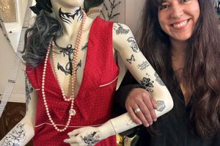 News-Register photos##Regina, upstairs at Parlor Tattoo and Zen Gallery, generally stays in the second-floor lobby, but owner Natalie Fletcher welcomes anyone who wants to get acquainted.