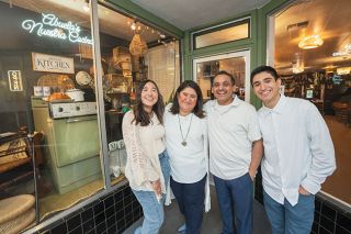 Rachel Thompson/News-Register##Fernandez family — parents Laura and Jimmy flanked by daughter Mariana and son Allan — stand in entry of Abuela’s Nuestra Cocina, the family’s new restaurant, a fulfillment of their hope to open a restaurant in downtown McMinnville.