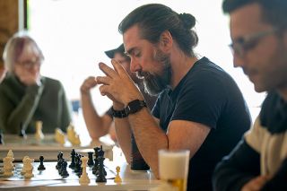 Rusty Rae/News-Register##Christefano Reyes, a founding member of the McMinnville Chess Club, concentrates during a match Wednesday. The two-year-old club meets weekly at Mac Market. Rusty Rae/News-Register##Christefano Reyes, a founding member of the McMinnville Chess Club, concentrates during a match Wednesday. The two-year-old club meets weekly at Mac Market.