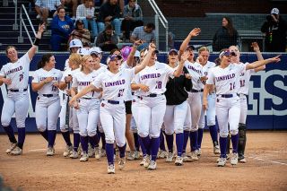 Rusty Rae/News-Register##Linfield’s softball team gives the crowd and the ball a “Seeya Ball” and points to the fence after a Meara Sains two-run blast Saturday against George Fox in the second game of the tournament. The Wildcats took thecontest, 6-0. Rusty Rae/News-Register##Linfield’s softball team gives the crowd and the ball a “Seeya Ball” and points to the fence after a Meara Sains two-run blast Saturday against George Fox in the second game of the tournament. The Wildcats took thecontest, 6-0.