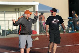 Rachel Thompson/News-Register##Yamhill Carlton head coach John Kuehnel, left, and Dayton coach Frank Baumholtz, havea friendly post-game conversation following the teams’ April 4 game. The two teams split the season series and are ranked No. 2 (Dayton) and No. 3 (YC) in the state. Rachel Thompson/News-Register##Yamhill Carlton head coach John Kuehnel, left, and Dayton coach Frank Baumholtz, havea friendly post-game conversation following the teams’ April 4 game. The two teams split the season series and are ranked No. 2 (Dayton) and No. 3 (YC) in the state.