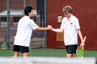 Rusty Rae/News-Register##Nylan Bills, left, and Jameson Rickards celebrate back-to-back districts doubles titles after finishing their three-set victory Saturday at Linfield. Rusty Rae/News-Register##Nylan Bills, left, and Jameson Rickards celebrate back-to-back districts doubles titles after finishing their three-set victory Saturday at Linfield.