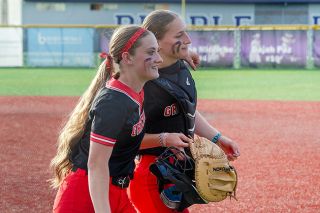 Rachel Thompson/News-Register##Senior Mackenzie Roberts and catcher Ava Fleischman are all smiles after Mac’s upset quarterfinal victory over No. 1 Sunset. Roberts pitched three innings and allowed one run (zero earned) in the Grizzlies quarter final win over Sunset. Rachel Thompson/News-Register##Senior Mackenzie Roberts and catcher Ava Fleischman are all smiles after Mac’s upset quarterfinal victory over No. 1 Sunset. Roberts pitched three innings and allowed one run (zero earned) in the Grizzlies quarter final win over Sunset.
