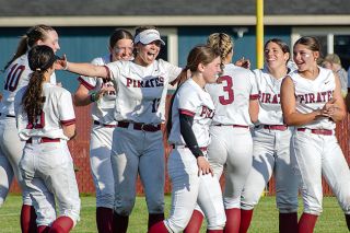 Rachel Thompson/News-Register##Dayton celebrates their semifinal victory over YC. It is the first time the Pirates have reached the championship since 2019. Post-game, they took photos with the local club softball team and Dayton football team who were in attendance to support with smiles shared all around. Rachel Thompson/News-Register##Dayton celebrates their semifinal victory over YC. It is the first time the Pirates have reached the championship since 2019. Post-game, they took photos with the local club softball team and Dayton football team who were in attendance to support with smiles shared all around.
