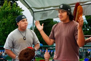 Emily Bonsant/News-Register##Alex Garcia, right, lifts his hands indicated his victory in the Lafayette Hot Dogs Eating Contest after extra time. Garcia and Tito Orosco, left, tied for first after downing seven hot dogs in five minutes. The victor was decided by a sudden-death final chow down for hot dog number eight. Emily Bonsant/News-Register##Alex Garcia, right, lifts his hands indicated his victory in the Lafayette Hot Dogs Eating Contest after extra time. Garcia and Tito Orosco, left, tied for first after downing seven hot dogs in five minutes. The victor was decided by a sudden-death final chow down for hot dog number eight.