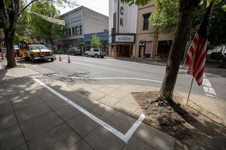 Rachel Thompson/News-Register##A taped outline near the corner of Third and Evans streets shows the future location of a planter box. This display is part of the city’s demonstration block, outlining features of the planned nine-block overhaul. Rachel Thompson/News-Register##A taped outline near the corner of Third and Evans streets shows the future location of a planter box. This display is part of the city’s demonstration block, outlining features of the planned nine-block overhaul.