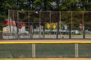 The stop sign gap, shown here from the infield of the McMinnville varsity softball field, provides Grizzly hitters with a visual cue when approaching the plate. Right-hand hitters would push the ball toward right field to aim for the signs, whereas left-handed hitters would pull the ball.
Nathan Ecker/News-Register The stop sign gap, shown here from the infield of the McMinnville varsity softball field, provides Grizzly hitters with a visual cue when approaching the plate. Right-hand hitters would push the ball toward right field to aim for the signs, whereas left-handed hitters would pull the ball.
Nathan Ecker/News-Register