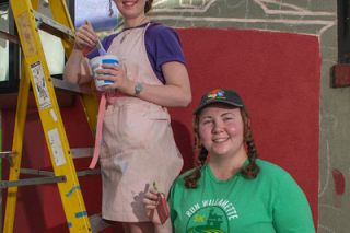 Rusty Rae/News-Register##Jillian Bird, right, and her sister, Karlee Pomeroy, are working on the newest mural in Art Alley, an outdoor gallery in downtown McMinnville. The mural features a familiar subject, Linfield University, where their dad works. Rusty Rae/News-Register##Jillian Bird, right, and her sister, Karlee Pomeroy, are working on the newest mural in Art Alley, an outdoor gallery in downtown McMinnville. The mural features a familiar subject, Linfield University, where their dad works.