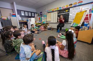 Rachel Thompson/News-Register##Teacher Kellie Morris leads Grandhaven kindergartners in singing “Willoughby Wallaby Woo” at Tuesday’s Kindergarten Camp, sparking laughter as each child hears a rhyming version of their name. Rachel Thompson/News-Register##Teacher Kellie Morris leads Grandhaven kindergartners in singing “Willoughby Wallaby Woo” at Tuesday’s Kindergarten Camp, sparking laughter as each child hears a rhyming version of their name.