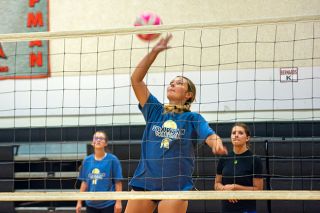 Middle blocker and junior co-captain Hayden Gram smacks a ball over the net during Sheridan volleyball practice on Aug. 26, in the interior gym of Faulconer-Chapman Elementary School.##Emily Bonsant/News-Register Middle blocker and junior co-captain Hayden Gram smacks a ball over the net during Sheridan volleyball practice on Aug. 26, in the interior gym of Faulconer-Chapman Elementary School.##Emily Bonsant/News-Register