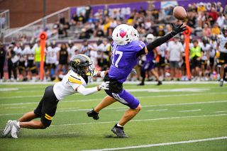 Linfield senior wide receiver Caleb Woodcock stretches out to catch a pass from junior quarterback Luke McNabb but is unable to pull it in as it grazes his fingertips. The Wildcats passing game was limited as they mustered just 128 yards through the air in their home opener at Maxwell Field on Saturday, Sept. 6. Woodcock had three receptions for 17 yards.##Rusty Rae/News-Register Linfield senior wide receiver Caleb Woodcock stretches out to catch a pass from junior quarterback Luke McNabb but is unable to pull it in as it grazes his fingertips. The Wildcats passing game was limited as they mustered just 128 yards through the air in their home opener at Maxwell Field on Saturday, Sept. 6. Woodcock had three receptions for 17 yards.##Rusty Rae/News-Register