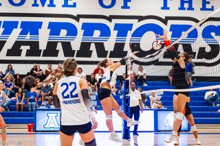 Warriors’ sophomore Ashlynn Nisly smacks the ball back over the net during the team’s home opener in their new gymnasium on Thursday, Sept. 4. Amity fell in three sets to Taft, but felt the support from a plethora of community members who came out to see the gym and cheer on the squad.##Rusty Rae/News-Register Warriors’ sophomore Ashlynn Nisly smacks the ball back over the net during the team’s home opener in their new gymnasium on Thursday, Sept. 4. Amity fell in three sets to Taft, but felt the support from a plethora of community members who came out to see the gym and cheer on the squad.##Rusty Rae/News-Register