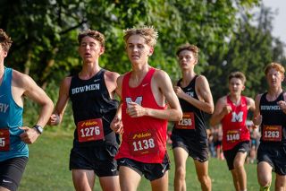 Isaiah Carpenter pushes on halfway through the boy’s 500-meter, trailing runners from Century and Sherwood.##Rachel Thompson/News-Register Isaiah Carpenter pushes on halfway through the boy’s 500-meter, trailing runners from Century and Sherwood.##Rachel Thompson/News-Register
