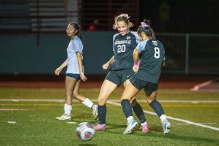 Rusty Rae/News-Register##Cameron Baker (No. 20) celebrates her game-leading goal with Maria Islas (No. 8) during the Grizzlies’ 6-0 win over Liberty at Wortman Stadium on Monday, Oct. 20. Baker notched Mac’s first and fourth goals. Rusty Rae/News-Register##Cameron Baker (No. 20) celebrates her game-leading goal with Maria Islas (No. 8) during the Grizzlies’ 6-0 win over Liberty at Wortman Stadium on Monday, Oct. 20. Baker notched Mac’s first and fourth goals.