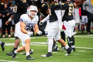 Rusty Rae/News-Register##Sophomore defensive end Cougar Bailey screams to his sideline after sacking PLU’s quarterback in Linfield’s 31-15 victory over the Lutes on Saturday, Oct. 25 in Parkland, Washington. Rusty Rae/News-Register##Sophomore defensive end Cougar Bailey screams to his sideline after sacking PLU’s quarterback in Linfield’s 31-15 victory over the Lutes on Saturday, Oct. 25 in Parkland, Washington.