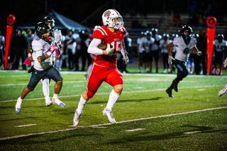 Rusty Rae/News-Register##Senior receiver Dylan Ferrua sprints toward the end zone on a large gain in the first quarter against Century on Friday, Oct. 24 at Wortman Stadium. The play put Mac in position to tie the game at 14-14. Ferrua ended his night with 149 yards receiving and a successful field goal to Mac ahead in quarter four. Rusty Rae/News-Register##Senior receiver Dylan Ferrua sprints toward the end zone on a large gain in the first quarter against Century on Friday, Oct. 24 at Wortman Stadium. The play put Mac in position to tie the game at 14-14. Ferrua ended his night with 149 yards receiving and a successful field goal to Mac ahead in quarter four.