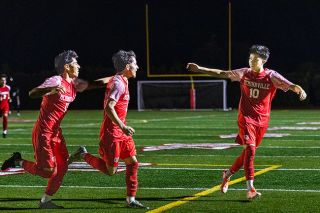 Nathan Ecker/News-Register##From left to right: “Cruz” Cuevas-George, Jose Farrias and Antonio Virrueta celebrate Farrias’ third-goal, marking his hat trick on Thursday, Oct. 23 against Sherwood at Wortman Stadium. Nathan Ecker/News-Register##From left to right: “Cruz” Cuevas-George, Jose Farrias and Antonio Virrueta celebrate Farrias’ third-goal, marking his hat trick on Thursday, Oct. 23 against Sherwood at Wortman Stadium.