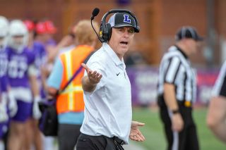 Rusty Rae/News-Register file photo##‘Cats head coach Joseph Smith voices his displeasure with an official on the sideline during Linfield’s contest against Whitworth on Oct. 18. Smith faces former Linfield coach and QB Brett Elliott on Saturday as Elliott leads Lewis and Clark in his first year as a college head coach. Rusty Rae/News-Register file photo##‘Cats head coach Joseph Smith voices his displeasure with an official on the sideline during Linfield’s contest against Whitworth on Oct. 18. Smith faces former Linfield coach and QB Brett Elliott on Saturday as Elliott leads Lewis and Clark in his first year as a college head coach.