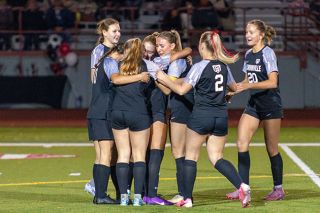 Nathan Ecker/News-Register##Teammates gather around to celebrate their seniors on the field at Wortman Stadium during the Grizzlies’ final home game on Monday, Oct. 27. In the middle, Marley Darling Peterson embraces Sofia Del Rayo. Del Rayo missed the season with an injury and Peterson was glad to share the field with her one last time. Nathan Ecker/News-Register##Teammates gather around to celebrate their seniors on the field at Wortman Stadium during the Grizzlies’ final home game on Monday, Oct. 27. In the middle, Marley Darling Peterson embraces Sofia Del Rayo. Del Rayo missed the season with an injury and Peterson was glad to share the field with her one last time.