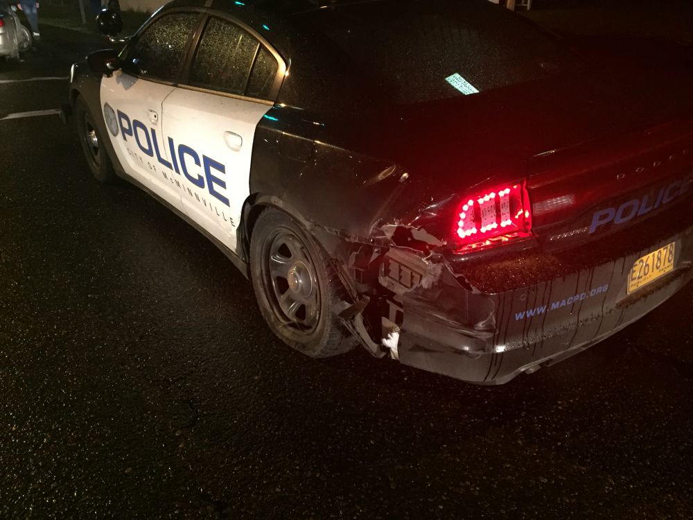McMinnville Police Department photo##A patrol car was heavily damaged when struck by another car Thursday night. The officer sustained a minor injury.