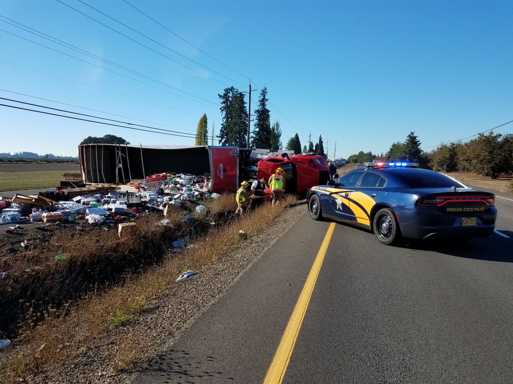 Photos courtesy Oregon State Police##A tractor-trailer rig lost its load of soda pop Thursday morning on Highway 99W.