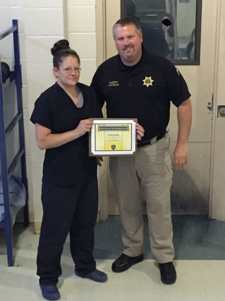 Submitted photo##Yamhill County Jail inmate Chrystal Harmes and Sheriff Tim Svenson.