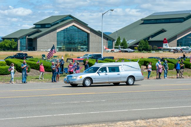 Rusty Rae/News-Register##A Macy and Son Funeral Director’s hearse passes by hundreds of supporters on Highway 18 with the body of Oregon Army National Guard soldier Pfc. Alexander Blake Klass of Willamina Thursday afternoon