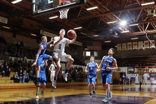 Rockne Roll/News-Register##
Amity s Devin McShane soars for a reverse lay-up in the Warriors consolation match against Blanchet Catholic. Rockne Roll/News-Register##
Amity s Devin McShane soars for a reverse lay-up in the Warriors consolation match against Blanchet Catholic.