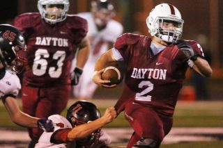 Rockne Roll/News-Register##
Dayton s Zach Russell (#2) eludes the grasp of Santiam Christian s Jaxon Connor (#71) and dashes for a big gain during the Pirates 37-19 upset of the Eagles. Russell recorded 135 rushing yards and a score in the winning effort. Rockne Roll/News-Register##
Dayton s Zach Russell (#2) eludes the grasp of Santiam Christian s Jaxon Connor (#71) and dashes for a big gain during the Pirates 37-19 upset of the Eagles. Russell recorded 135 rushing yards and a score in the winning effort.