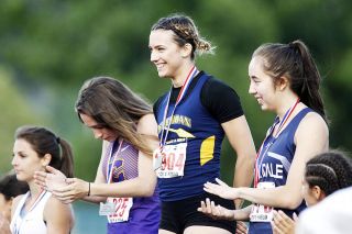 Rockne Roll/News-Register##
Sheridan s Ronni VanZant poses with her third state title - the girls 200m championship. Rockne Roll/News-Register##
Sheridan s Ronni VanZant poses with her third state title - the girls 200m championship.