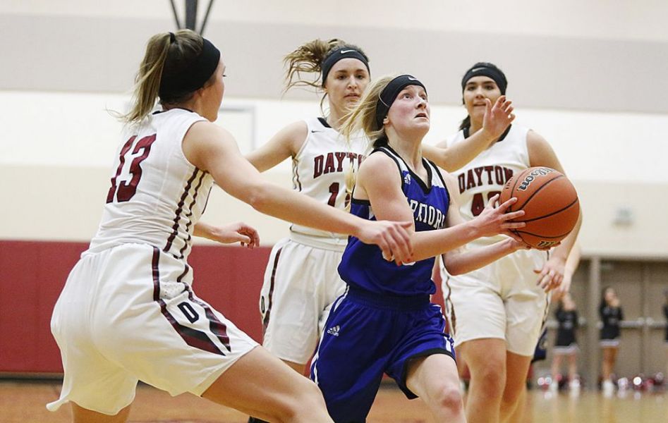 Rockne Roll/News-Register##
Amity s Alyssa Plummer looks to finish on the fast break as Dayton s Jaden Moore (13), Shawnie Spink (11) and Chloe Cisneros (40) chase her down.