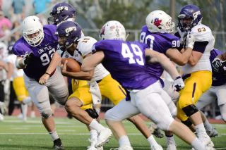 Marcus Larson/News-Register##
Crusader QB T.J. Josey beat the Cats with his legs and foot speed, getting a 74-yard TD run early in the first quarter, and tossing a 35-yard TD pass in the fourth quarter. Here Devon Illingworth (92) and Asa Schwartz sandwich Josey. Marcus Larson/News-Register##
Crusader QB T.J. Josey beat the Cats with his legs and foot speed, getting a 74-yard TD run early in the first quarter, and tossing a 35-yard TD pass in the fourth quarter. Here Devon Illingworth (92) and Asa Schwartz sandwich Josey.