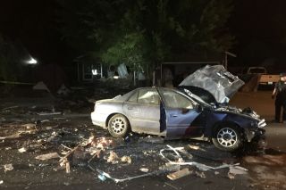 Submitted photo##The car ended up on Darci Drive after traveling through a house Submitted photo##The car ended up on Darci Drive after traveling through a house