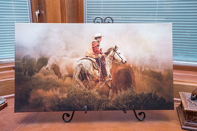 Marcus Larson/News-Register##Horses and cowboys are favorite subjects. Goodrich often adds dramatic skies to her images.