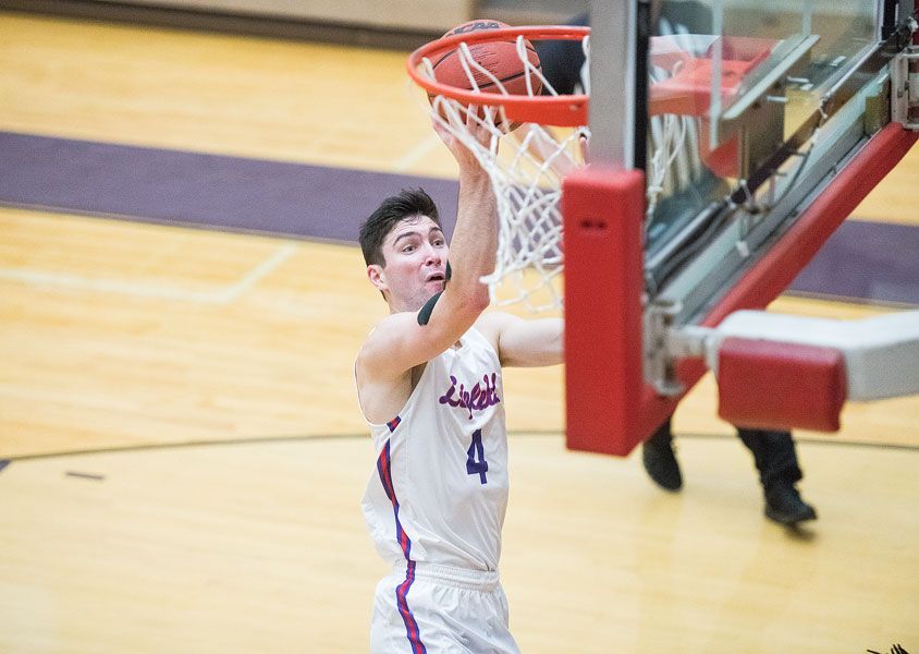 Rusty Rae/News-Register##
Linfield wing Dempsey Roggenbuck soars to the hoop for two points during the team’s matchup against Louisiana College. Roggenbuck scored a team-high 20 points in the Wildcat loss.