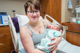 Marcus Larson / News-Register##Melissa Grimes holds Sephia, the first baby of 2019. Marcus Larson / News-Register##Melissa Grimes holds Sephia, the first baby of 2019.