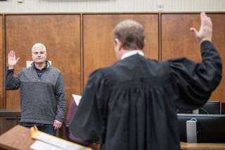 Rusty Rae/News-Register##Kit Johnson is sworn into his first term as Yamhill County Commissioner by Judge Ladd Wiles. Rusty Rae/News-Register##Kit Johnson is sworn into his first term as Yamhill County Commissioner by Judge Ladd Wiles.