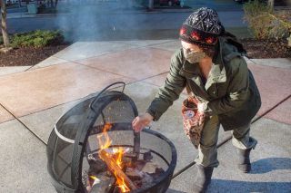 Rusty Rae/News-Register ## Kathleen McKinney feeds the Burning The Old Year fire with notes about what she wished to forget about 2020. The First Baptist Church hosted the event. Rusty Rae/News-Register ## Kathleen McKinney feeds the Burning The Old Year fire with notes about what she wished to forget about 2020. The First Baptist Church hosted the event.